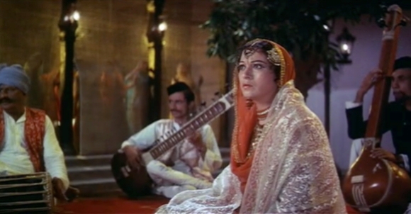 Nawabjaan, played by Veena, watches in horror as Pakeezah's father enters the circus.