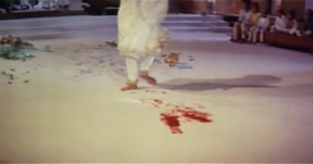 Pakeezah's blood begins to stain the white sheets on which she dances.