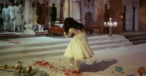 Leaving a trail of blood behind her, Pakeezah stumbles across the floor to the horror of onlookers.